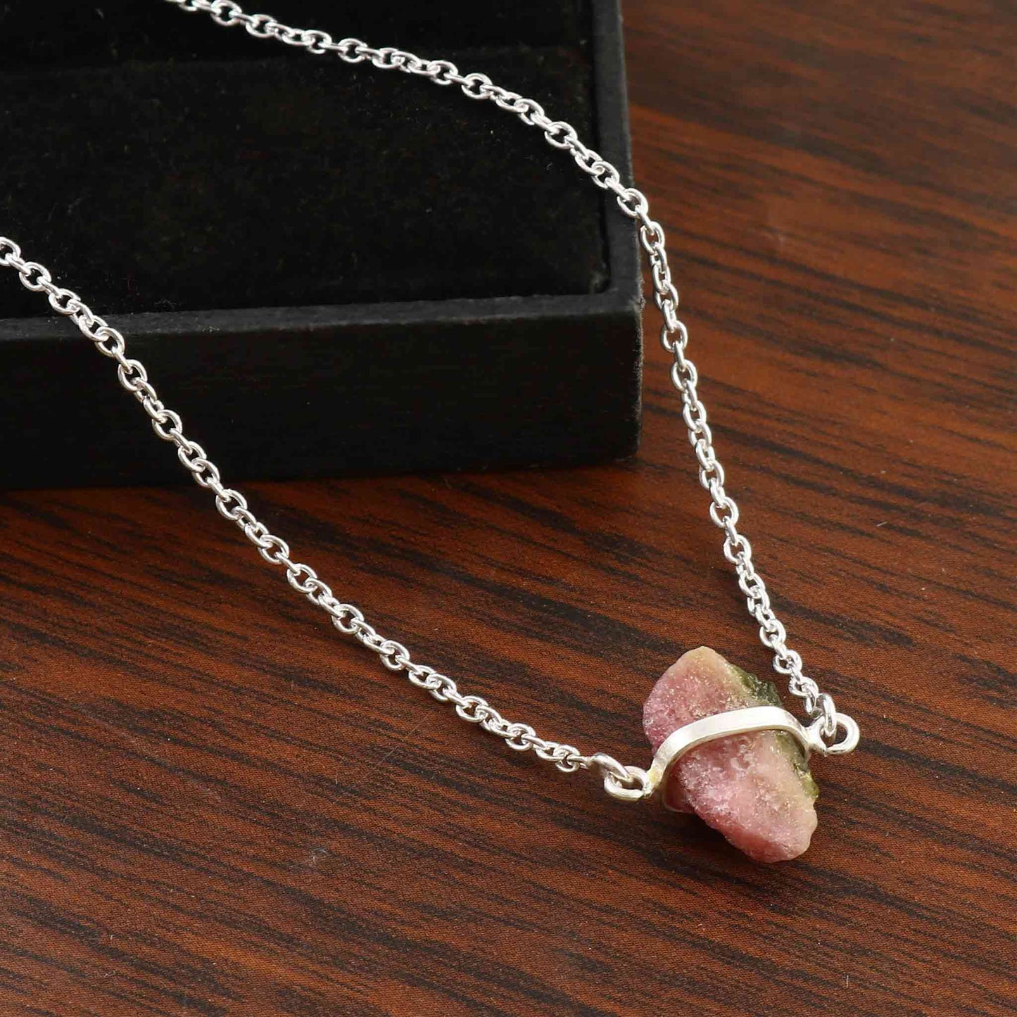 Raw pink tourmaline necklace with sterling silver chain, featuring natural, unique stones in free-form shapes.