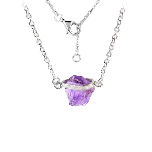 Elegant raw Amethyst crystal necklace with sterling silver chain, featuring natural, unique stones in a free-form shape.