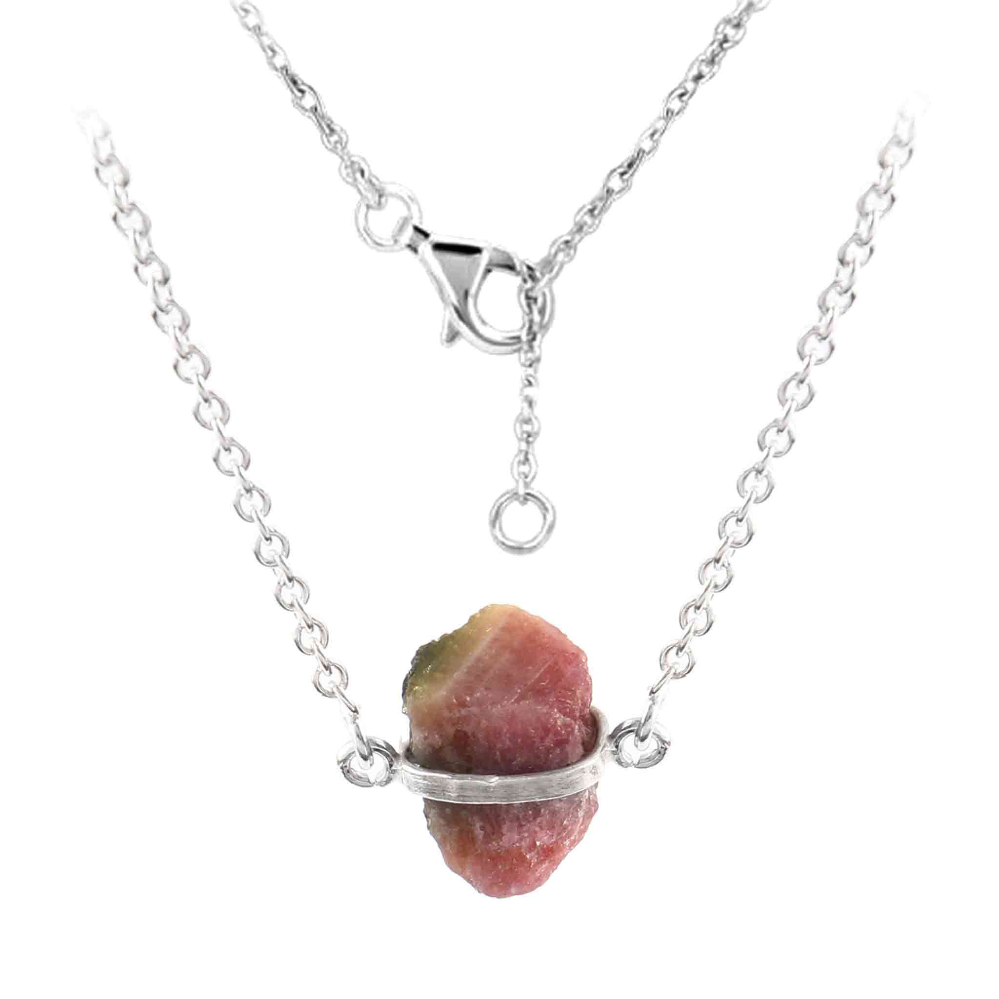 Raw pink tourmaline necklace with sterling silver chain, featuring natural, unique stones in free-form shapes.