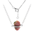 Raw pink tourmaline necklace with sterling silver chain, featuring natural, unique stones in free-form shapes.