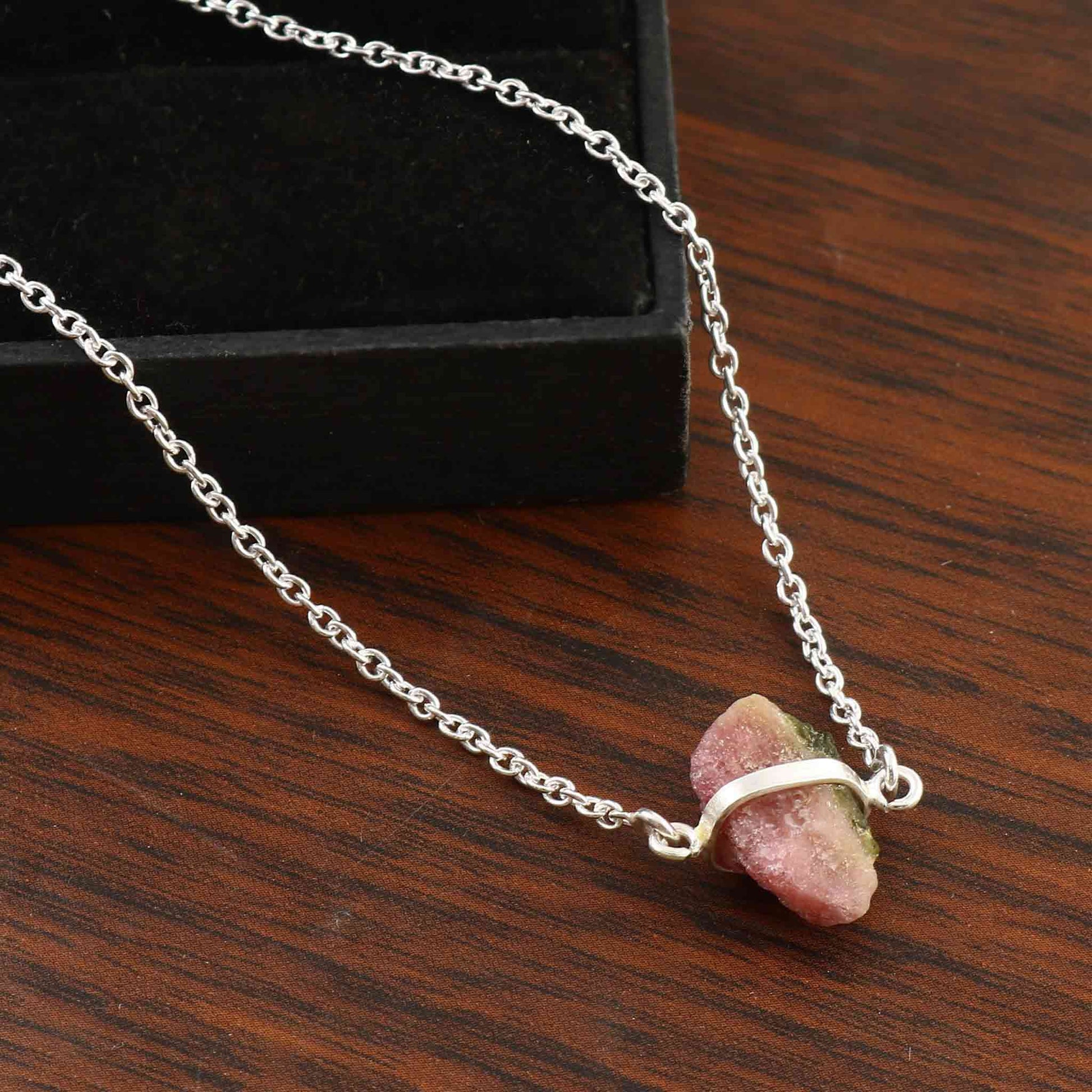 Raw pink tourmaline necklace with sterling silver chain, featuring natural, unique stones in free-form shapes.
