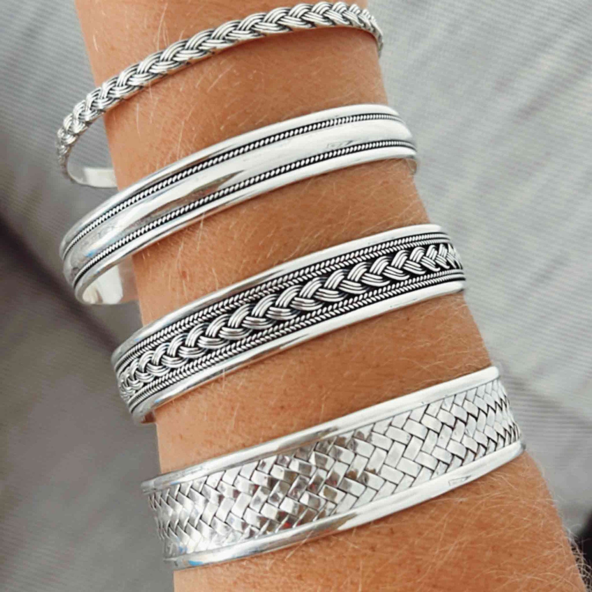 Sterling Silver Bangle Bracelet with an oxidized finish and adjustable cuff design. Includes a free polishing cloth with purchase.