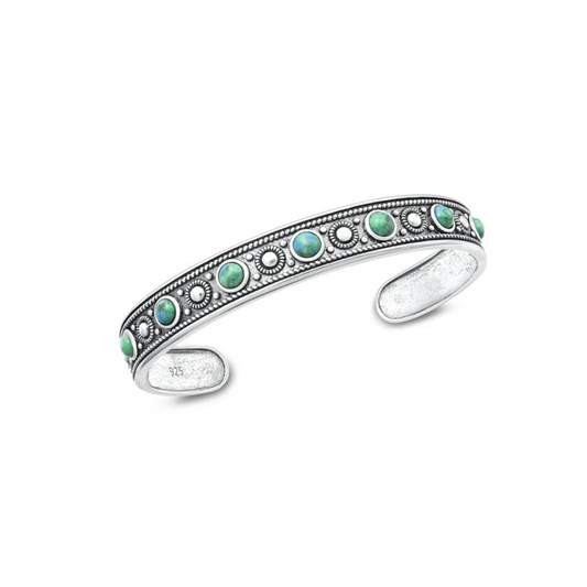 Sterling silver tribal bangle with green turquoise stones and oxidised detail