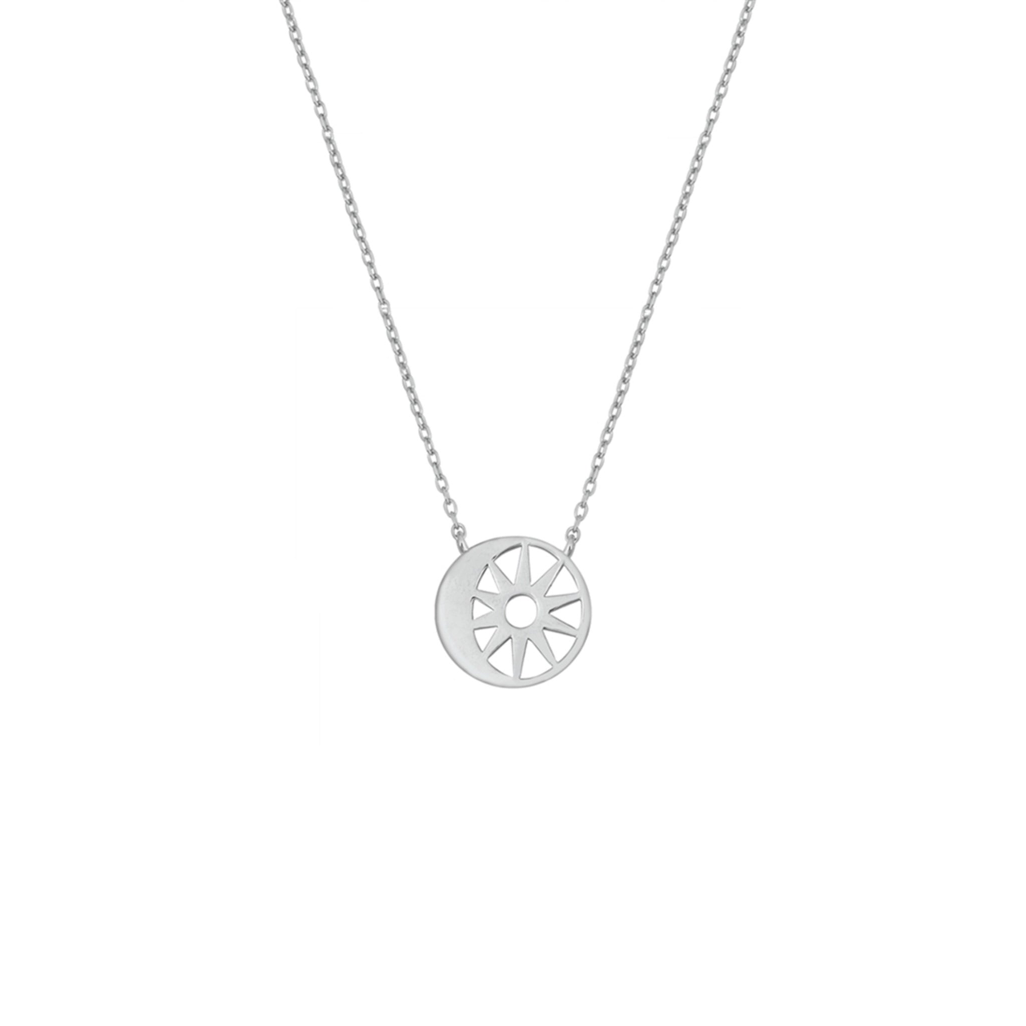 Minimalist silver necklace featuring a dainty moon and sun pendant, lightweight and elegant design.